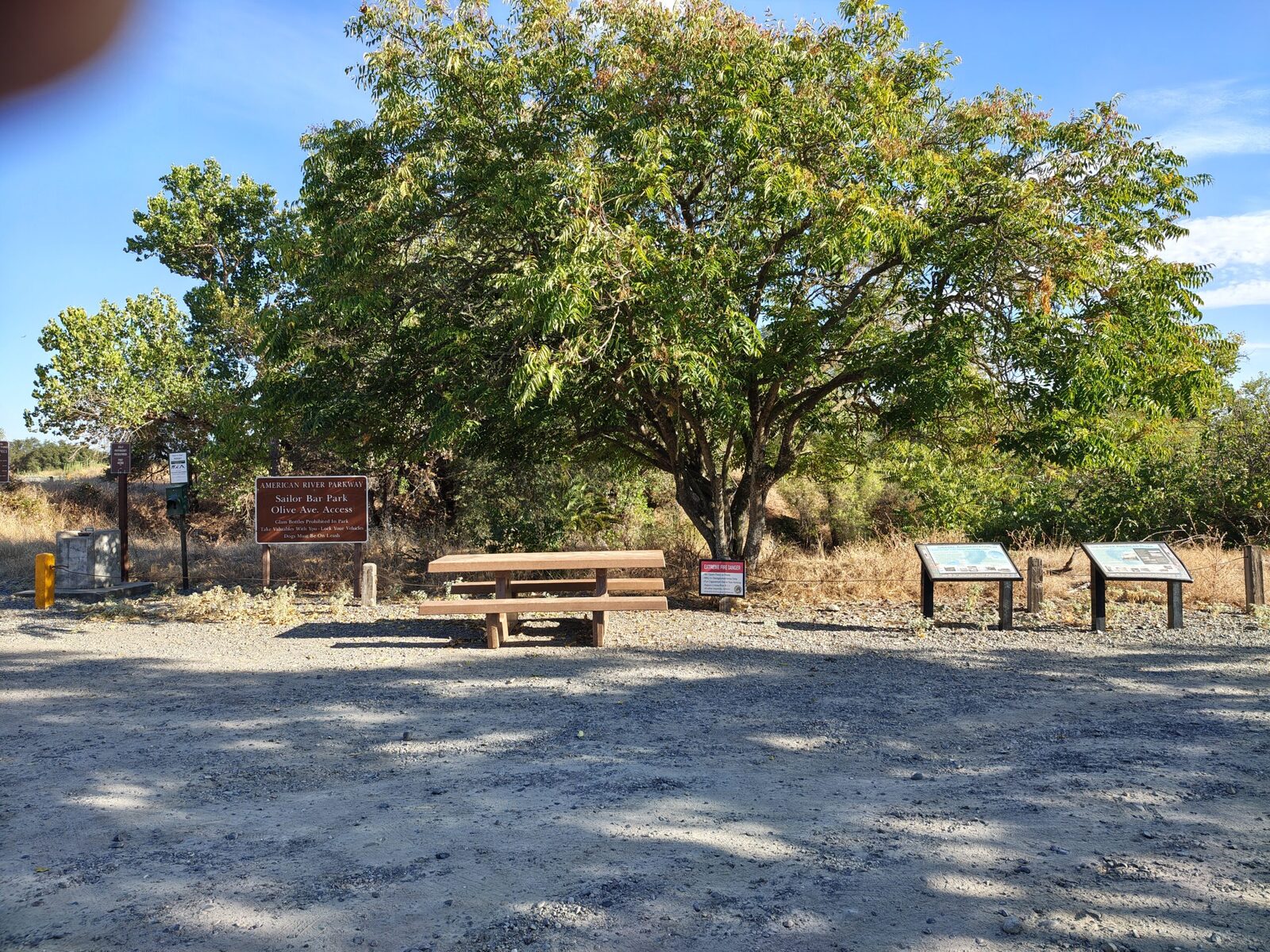 A bench and interpretive panels near the parking area