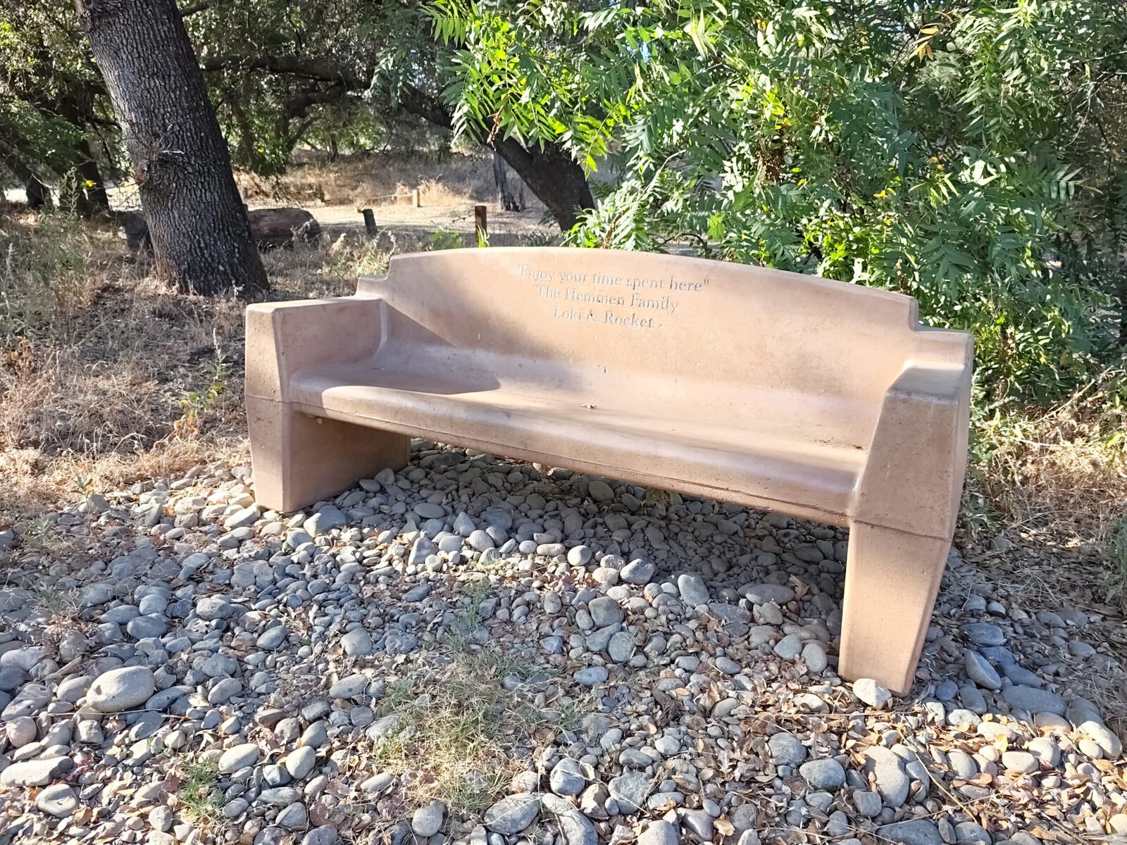 A bench on the cobbles at the water's edge